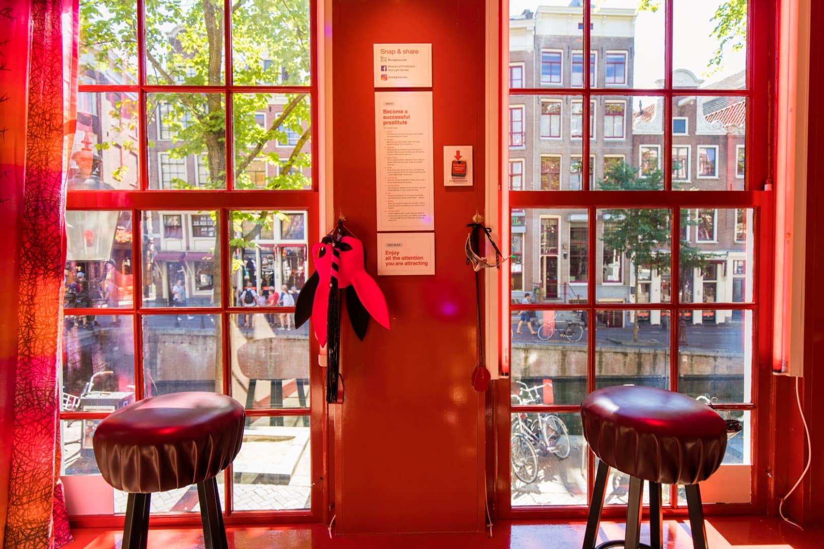 Sit Behind the Famous Red-Lit Window
